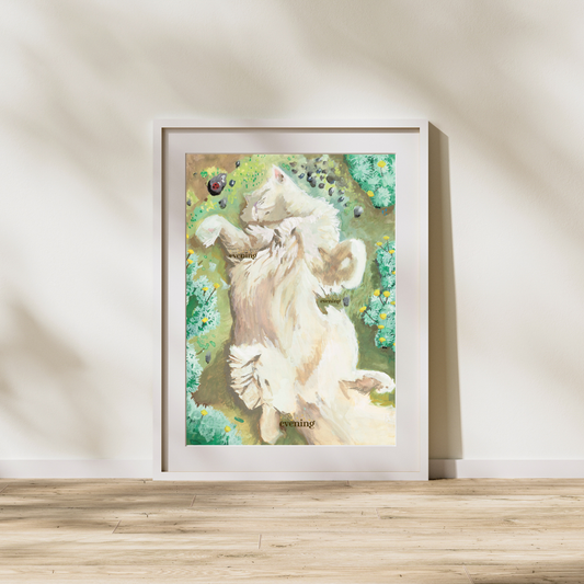 Framed artwork of a cat in a garden on a wall.