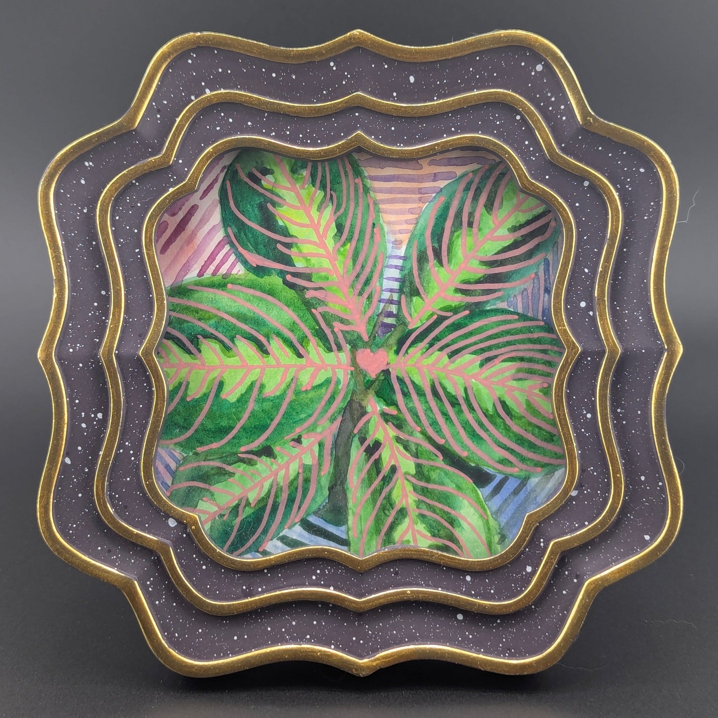 Decorative plate with a floral design on a gray background