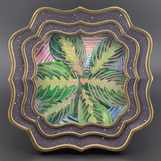 Decorative plate with a floral design on a gray background