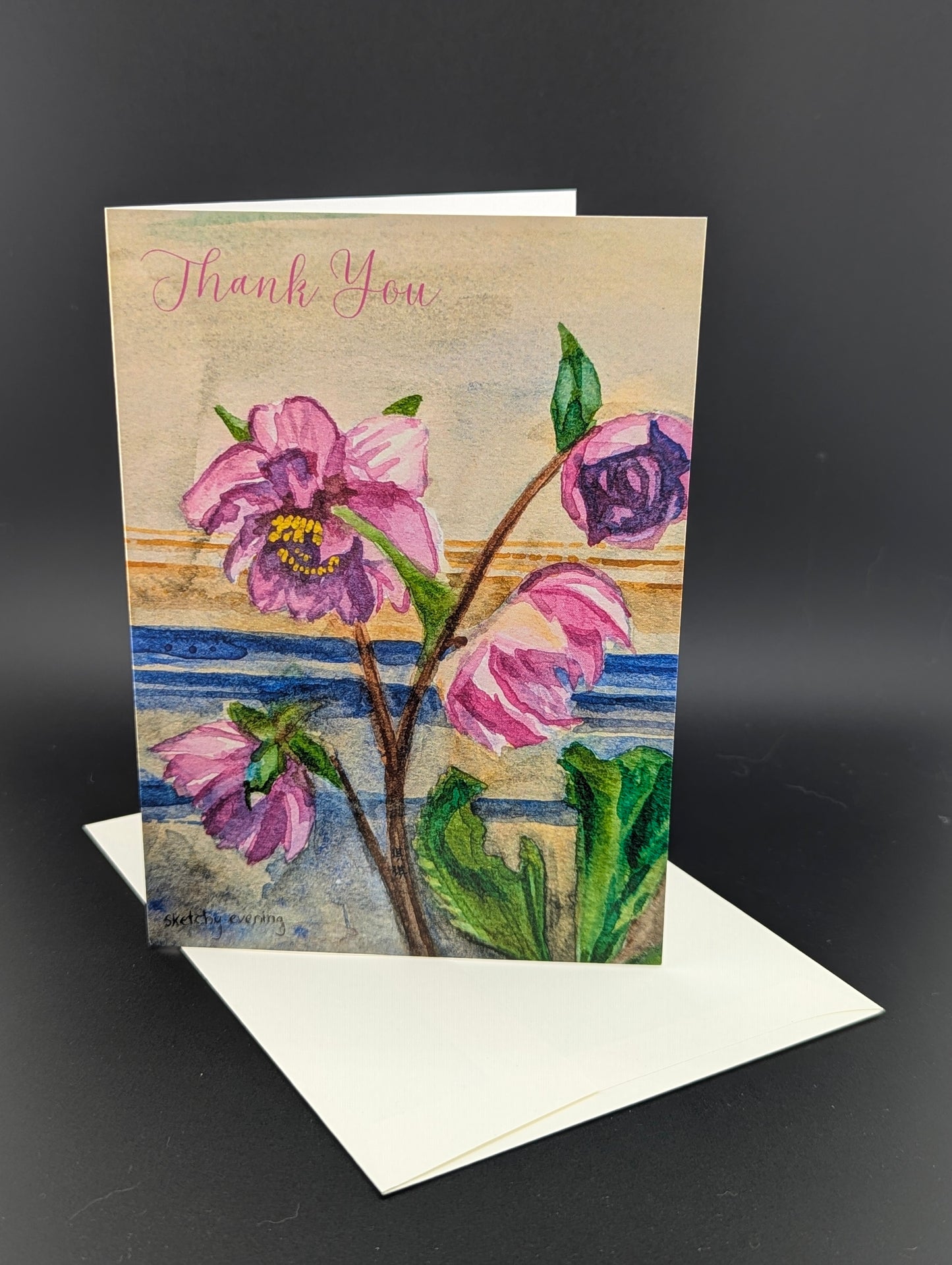 Greeting card with pink flowers and 'Thank You' text on a dark background
