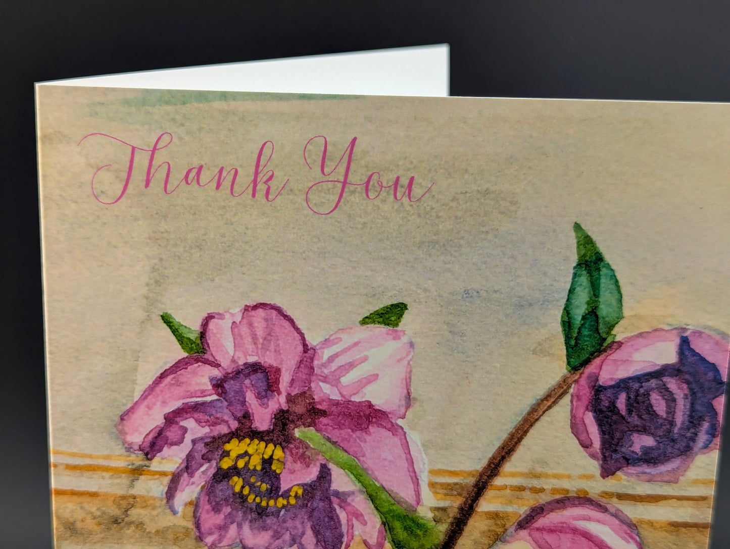 Greeting card with pink flowers and 'Thank You' text on a textured background