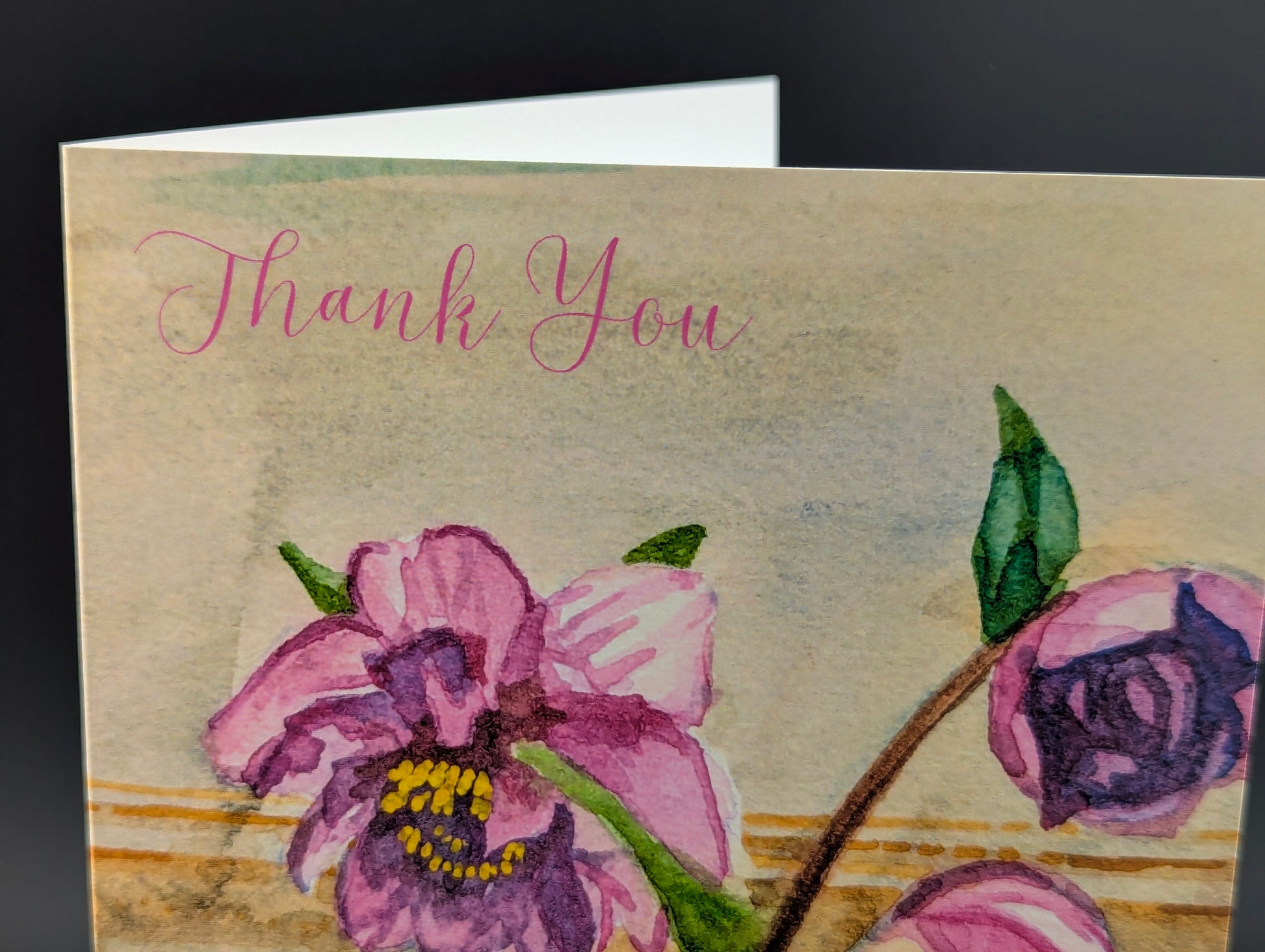 Greeting card with pink flowers and 'Thank You' text on a textured background