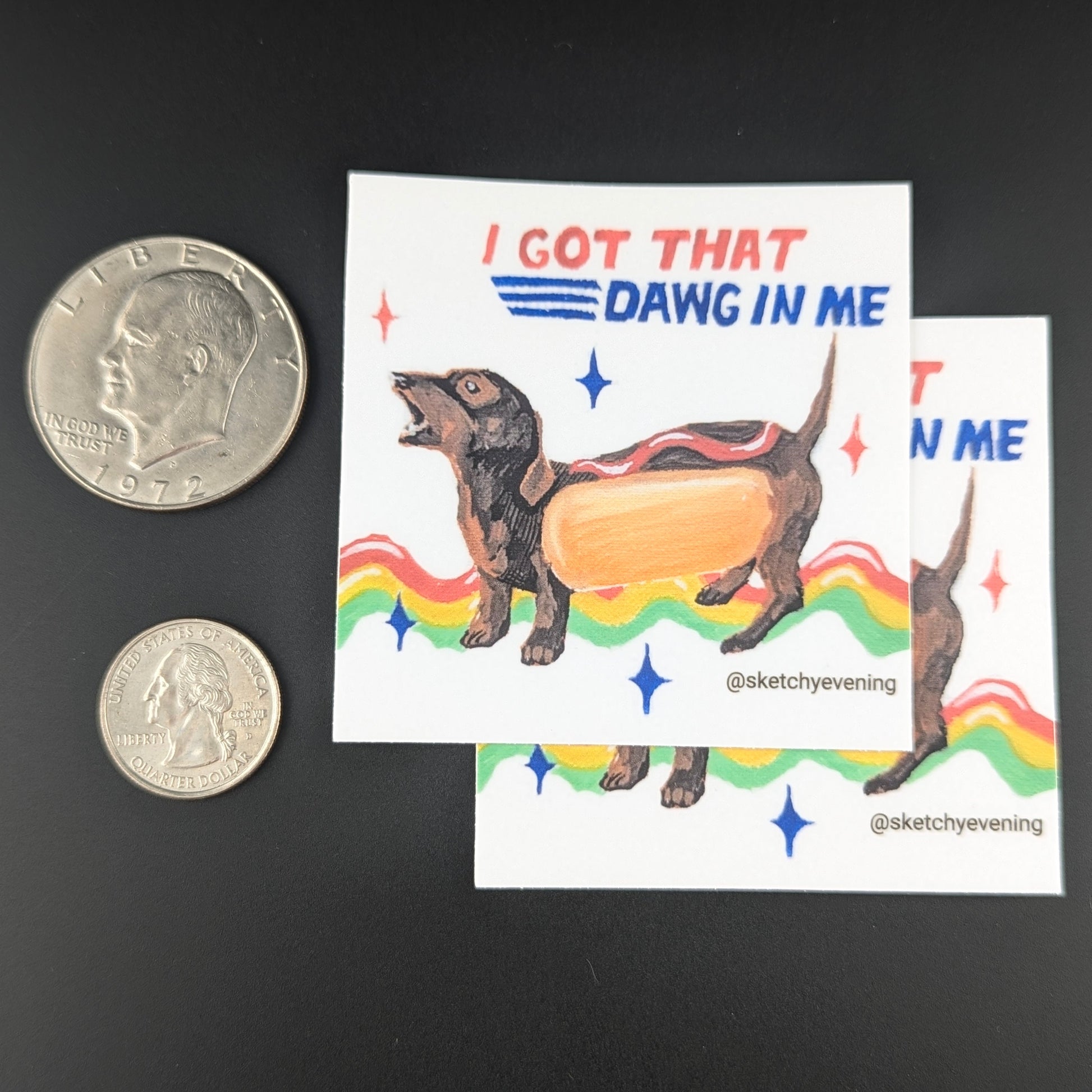 Sticker with a dachshund and hot dog illustration and text 'I GOT THAT DAWG IN ME' on a dark background