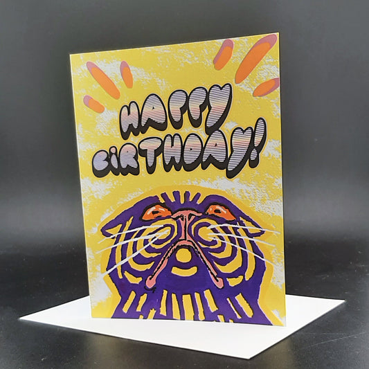 Birthday card with a colorful tiger design and 'Happy Birthday!' text on a black background.