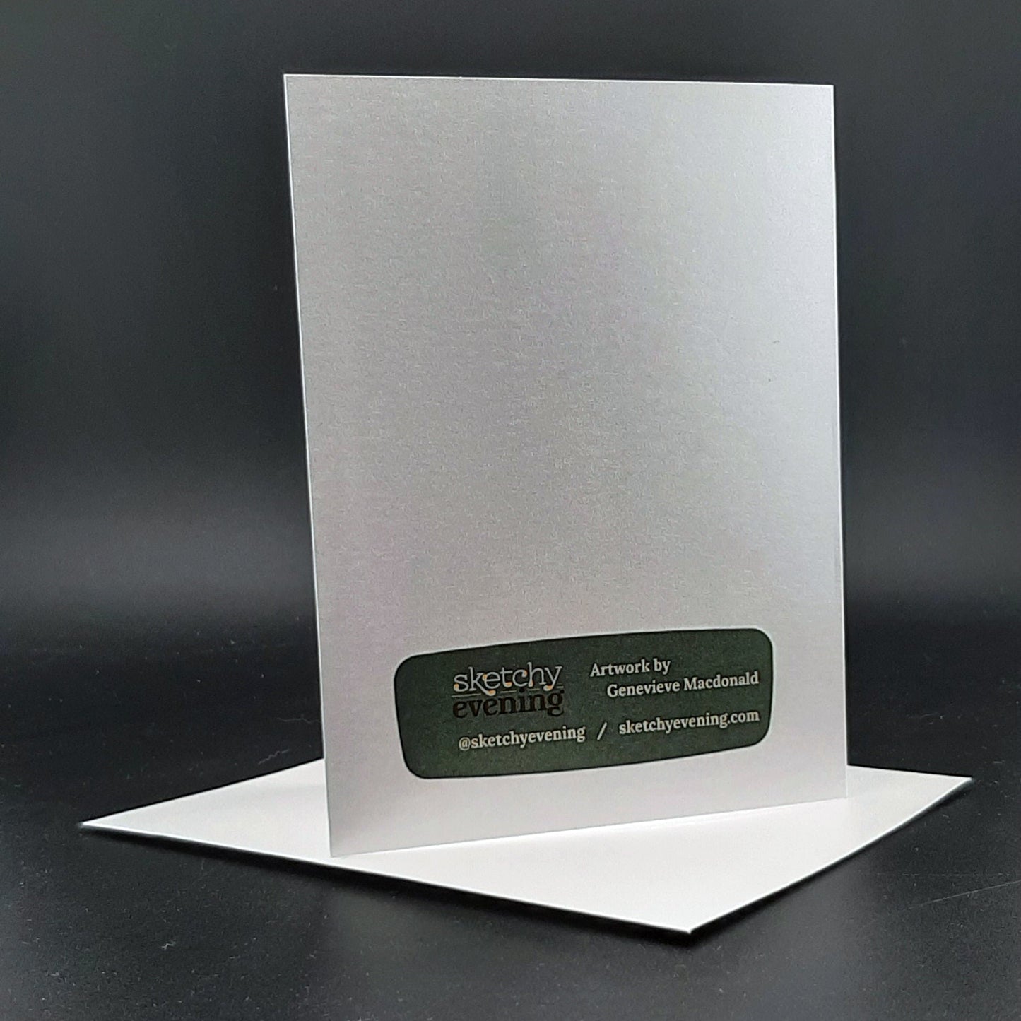 Greeting card with a black label on a dark gray background