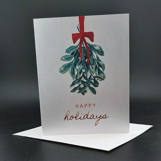 Greeting card with mistletoe design and 'Happy holidays' text on a dark background